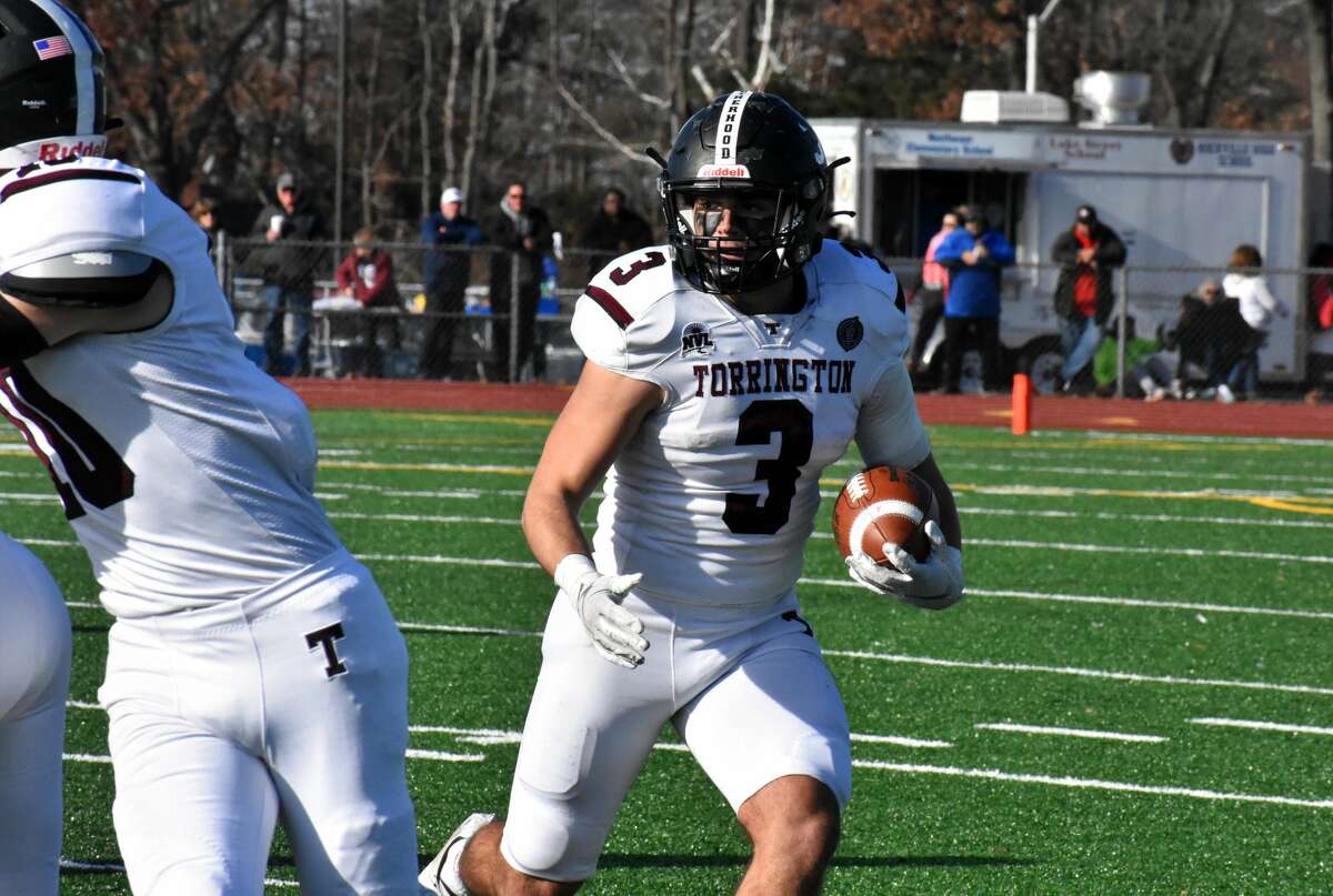 Torrington's Sean Clinkscales runs the ball during the Class M state semifinal football game at Rockville high school, Vernon on Sunday, Dec. 5, 2021.