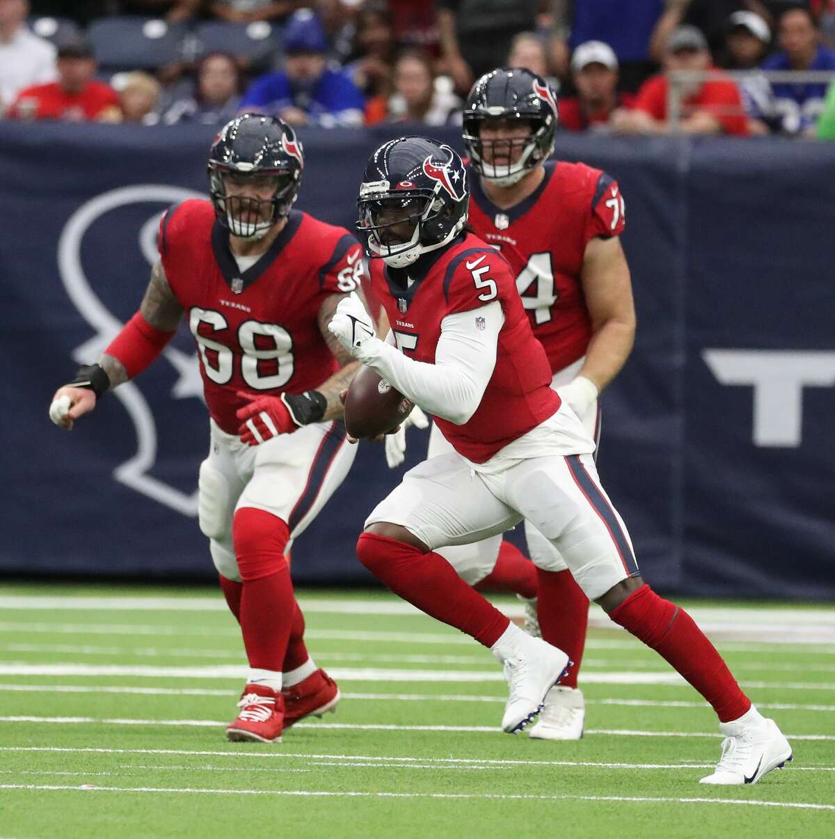 Houston Texans linebacker Christian Kirksey (58), Houston Texans defensive  back Tavierre Thomas (37) and Houston Texans defensive back Justin Reid  (20) bring down Indianapolis Colts wide receiver Ashton Dulin (16) during an