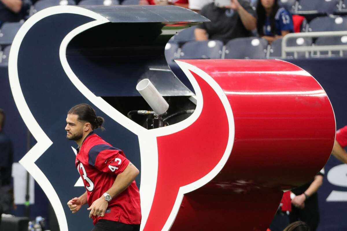 Houston Astros pitcher Lance McCullers, Jr., jogs onto the field as he is introduced as Texans home field advantage caption before the Texans game against the Indianapolis Colts Sunday, Dec. 5, 2021 in Houston.