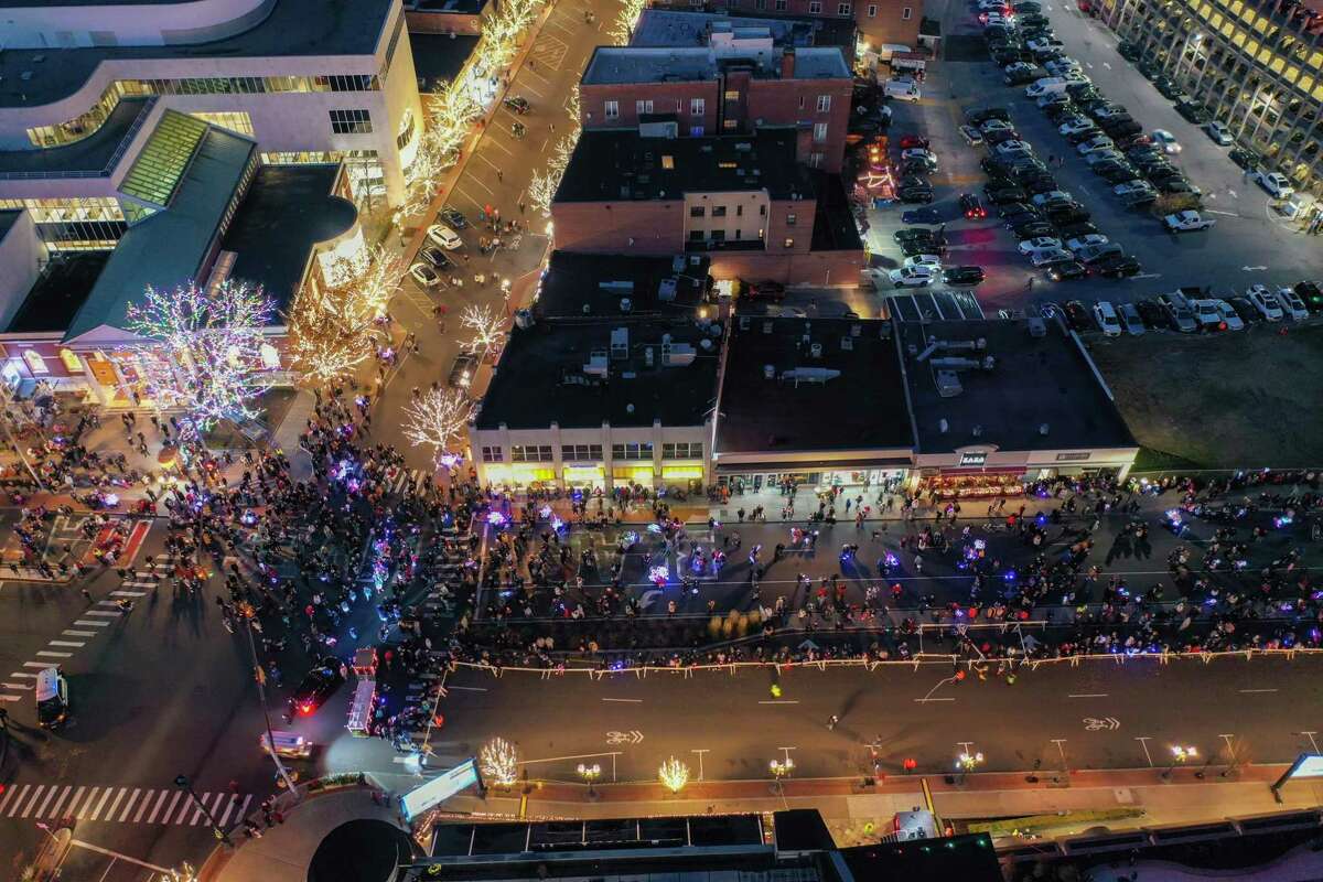A drone view as Santa and friends took a traditional leap off the tallest building in Stamford Sunday, rappelling down the Landmark Building as a crowd gathers below.