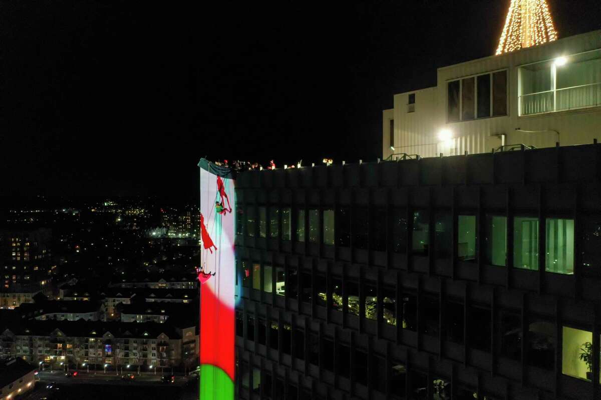 A drone view as Santa and friends took a traditional leap off the tallest building in Stamford Sunday, rappelling down the Landmark Building.