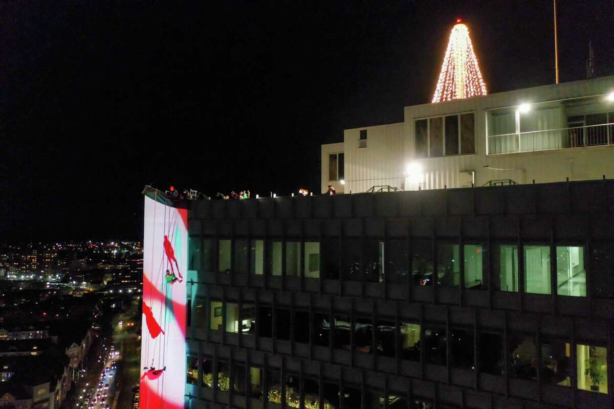 A drone view as Santa and friends took a traditional leap off the tallest building in Stamford Sunday, rappelling down the Landmark Building.