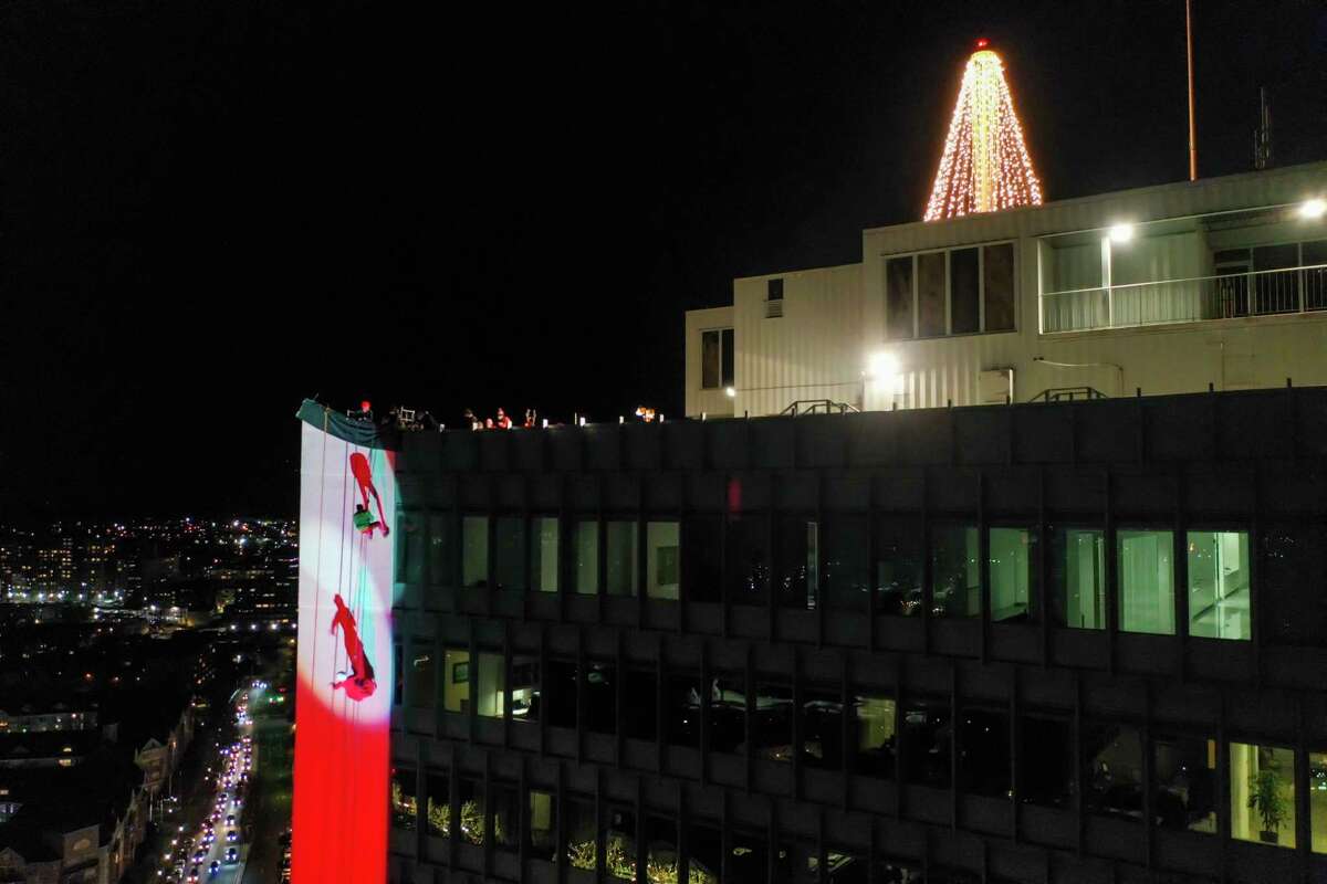 A drone view as Santa and friends took a traditional leap off the tallest building in Stamford Sunday, rappelling down the Landmark Building.