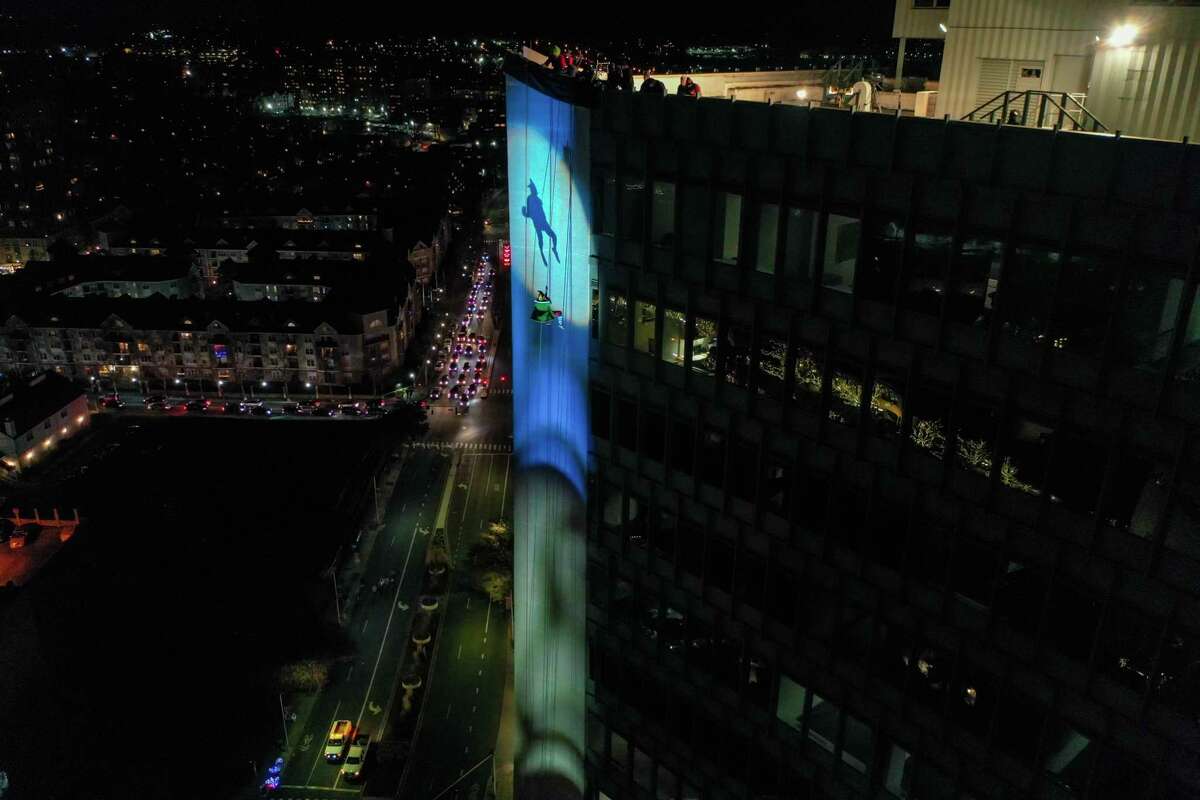 A drone view as Santa and friends took a traditional leap off the tallest building in Stamford Sunday, rappelling down the Landmark Building.