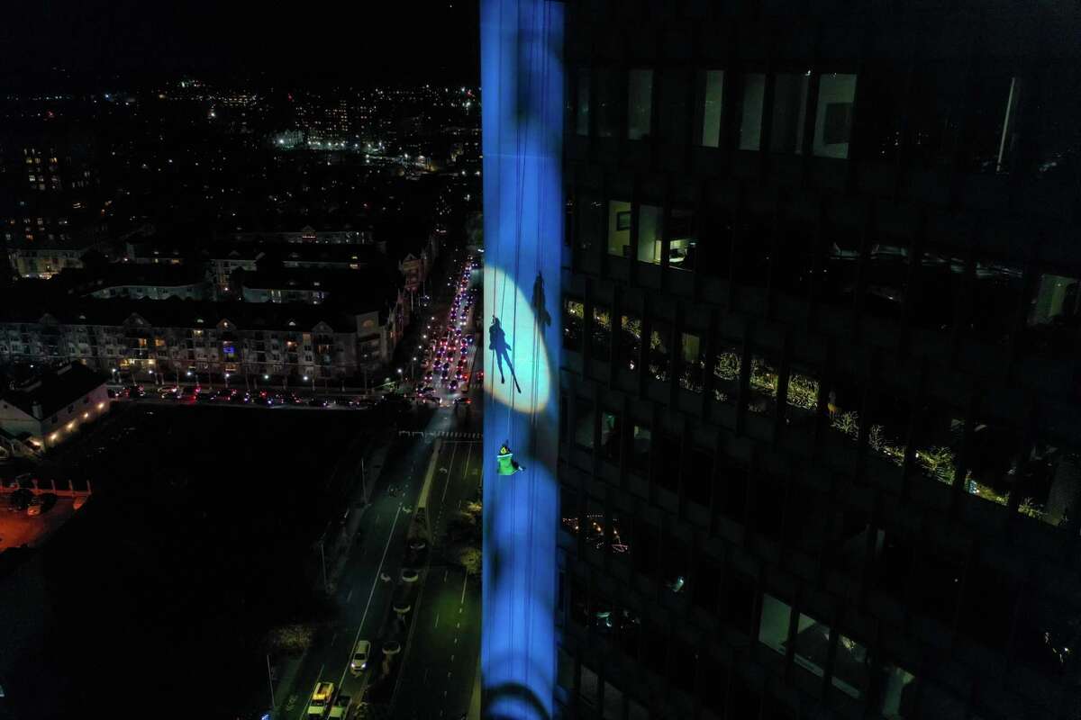 A drone view as Santa and friends took a traditional leap off the tallest building in Stamford Sunday, rappelling down the Landmark Building.