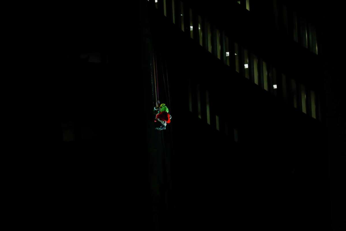 A drone view as Santa and friends took a traditional leap off the tallest building in Stamford Sunday, rappelling down the Landmark Building.