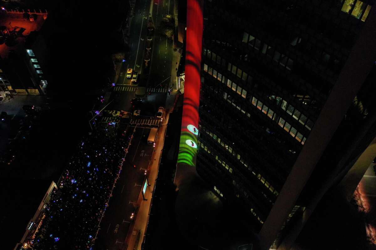 A drone view as Santa and friends took a traditional leap off the tallest building in Stamford Sunday, rappelling down the Landmark Building.