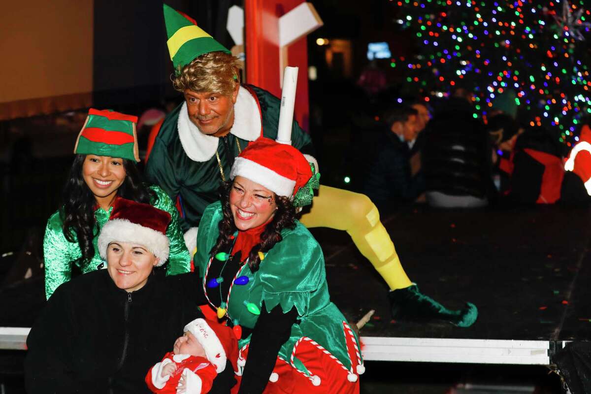 Santa and friends took a traditional leap off the tallest building in Stamford Sunday, rappelling down the Landmark Building.
