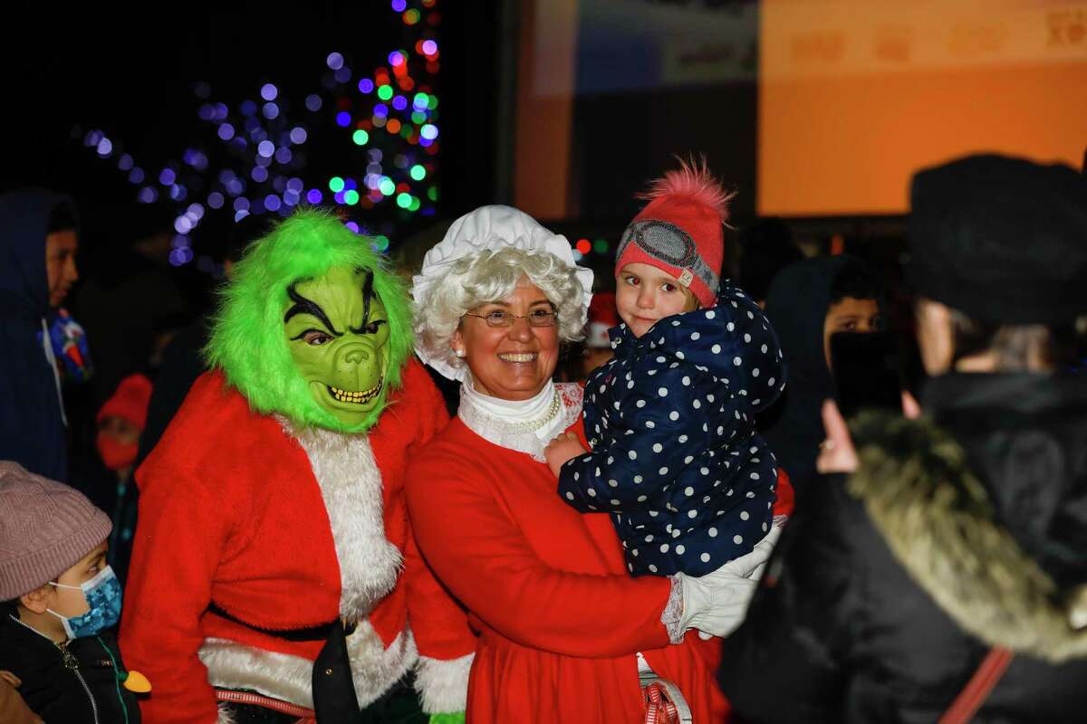 Santa and friends took a traditional leap off the tallest building in Stamford Sunday, rappelling down the Landmark Building.