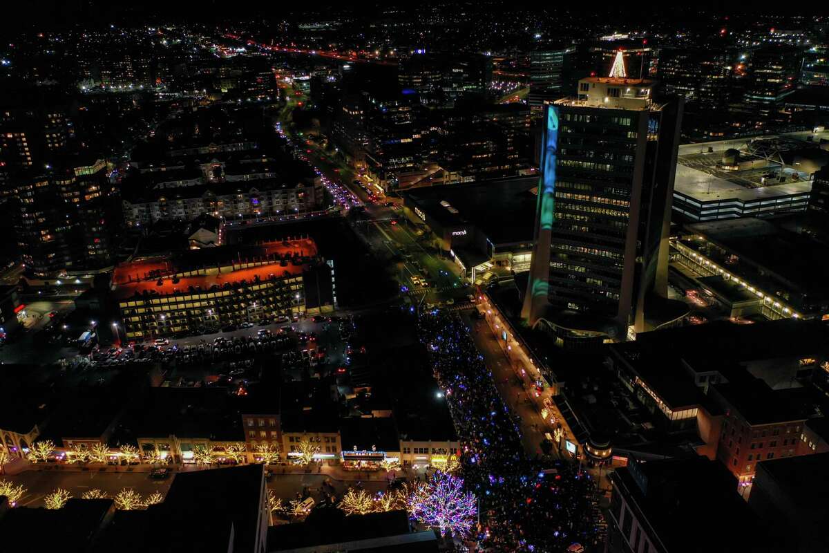A drone view as Santa and friends took a traditional leap off the tallest building in Stamford Sunday, rappelling down the Landmark Building.