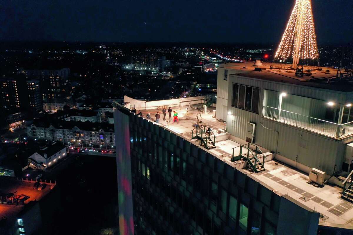A drone view as Santa and friends took a traditional leap off the tallest building in Stamford Sunday, rappelling down the Landmark Building.