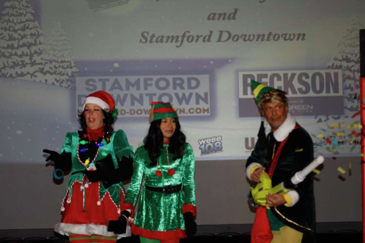 Santa and friends took a traditional leap off the tallest building in Stamford Sunday, rappelling down the Landmark Building.