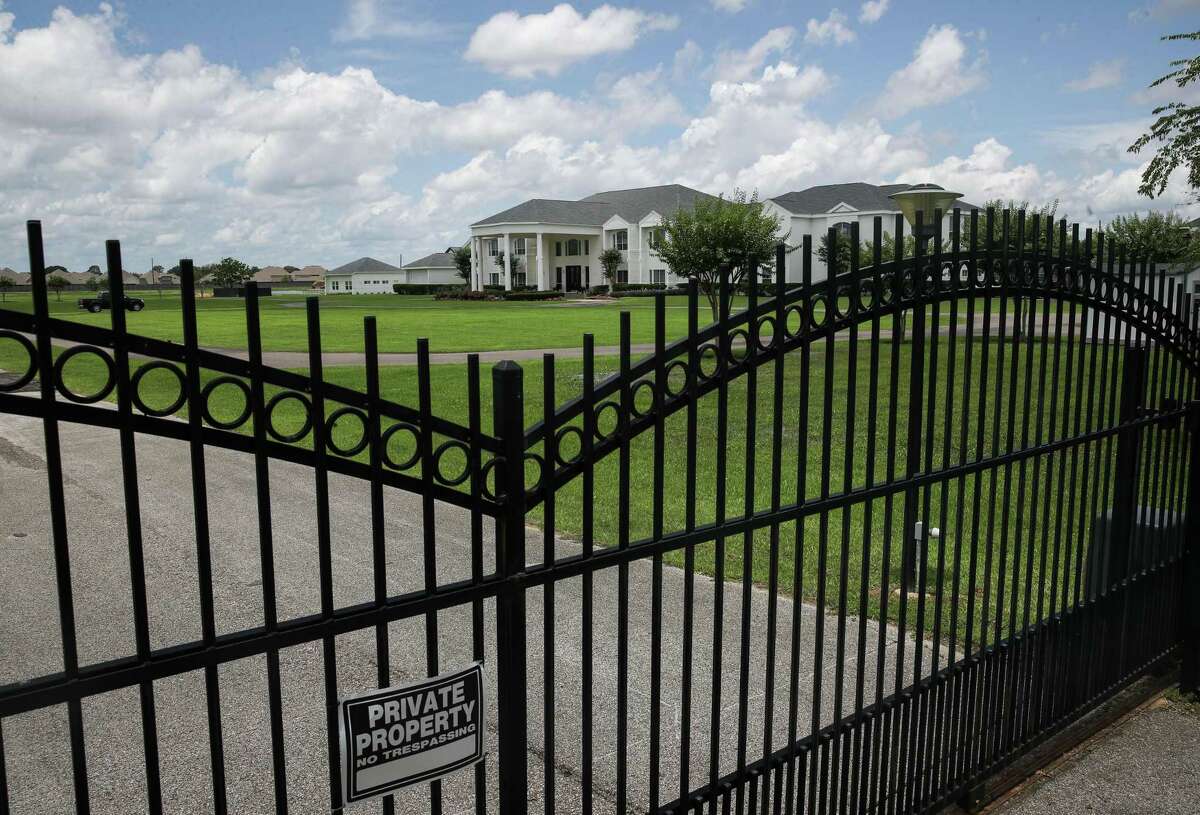 High-profile pastor I.V. Hilliard lives in a 24,900-square-foot home on this 11.8-acre property in Spring. The property has several smaller buildings that are used as a conference and retreat center. The 11.8-acre lot includes three hot tubs, two fountains and a swimming pool and tennis court, property records show.