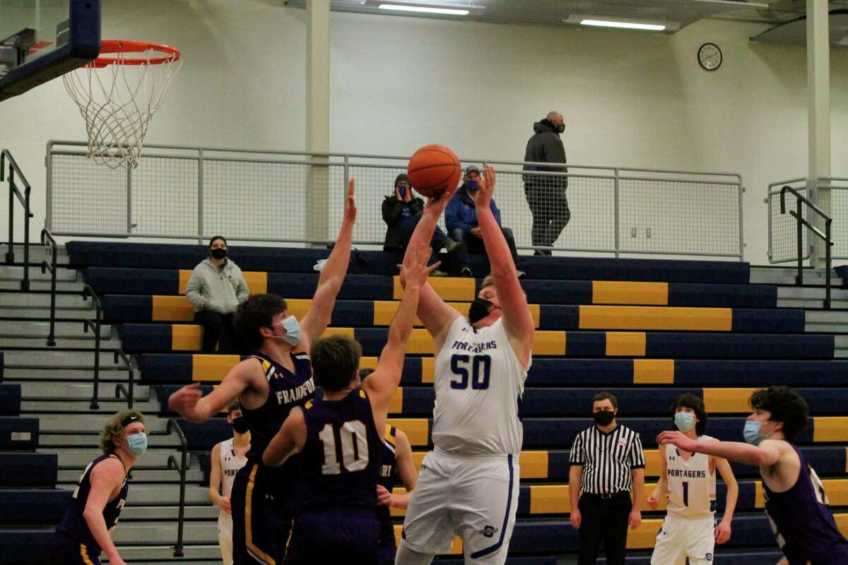 Onekama's Adam Domres puts up a shot in the lane against Frankfort.