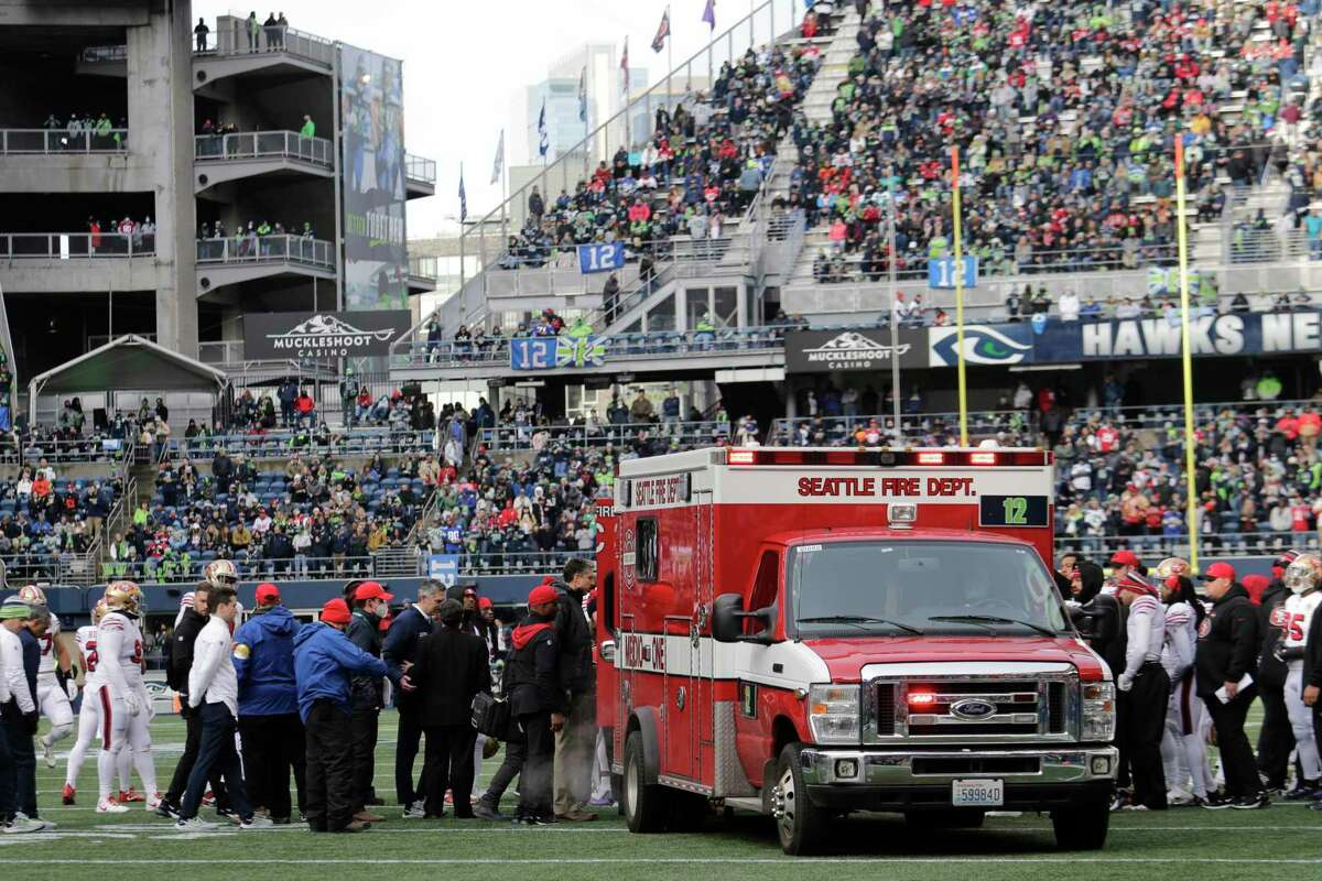 San Francisco 49ers running back Trenton Cannon is loaded into an ambulance after an injury during the first half of an NFL football game against the Seattle Seahawks at Lumen Field, Sunday, Dec. 5, 2021, in Seattle. (AP Photo/John Froschauer)