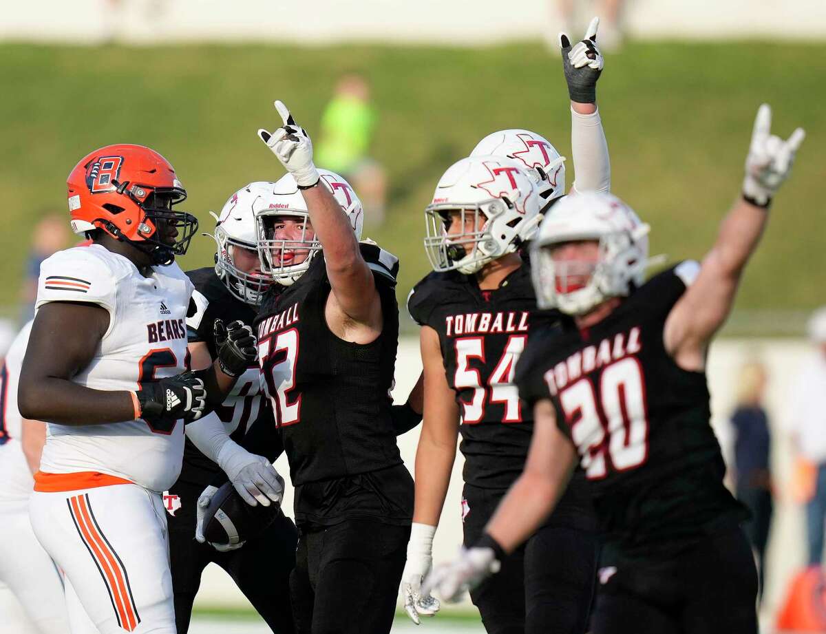 Tomball defensive lineman Luke Roaten, second from left, celebrates his fumble recovery during the second half of the 6A Division II Region 3 Final high school football playoff game against Bridgeland, Saturday, Dec. 4, 2021, in Tomball.