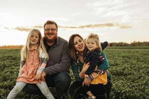 Ashley Kennedy, Young Farmer award winner, and her family.