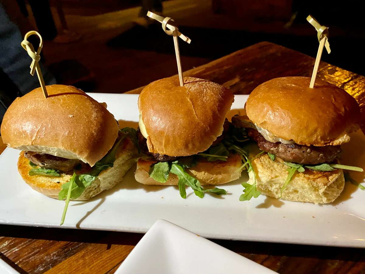 Lamb sliders at The City Beer Hall are topped with Taleggio, arugula, balsamic aioli and fig mostarda. 