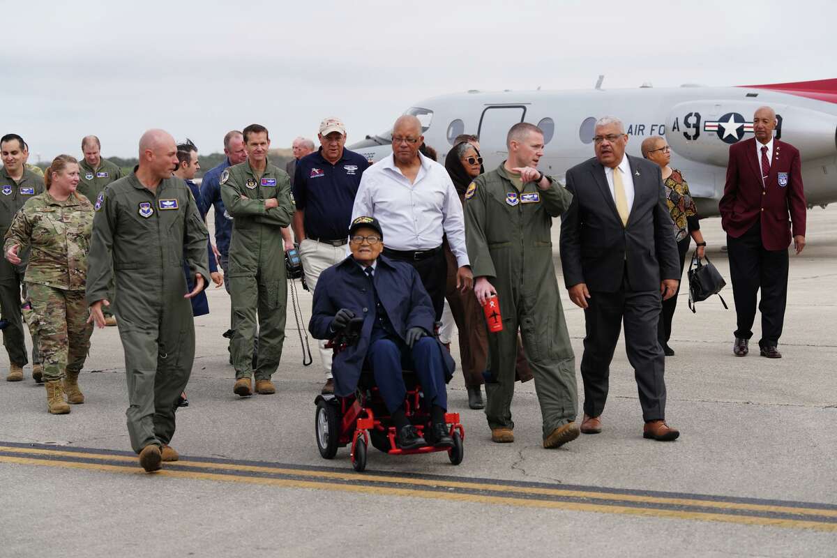 Retired Brig. Gen. Charles McGee moves along the flight line with family and airmen during events Monday at the Air Force 99th Flying Training Squadron at Joint Base San Antonio-Randolph. McGee, a Tuskegee Airman, turns 102 on Tuesday.
