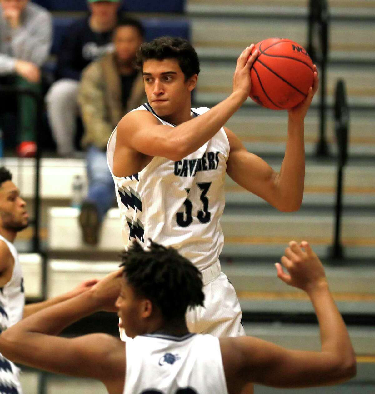 College Park small foward Xander Singh (33) grabs a rebound during the first quarter of a high school basketball game at College Park High School, Tuesday, Nov. 23, 2021, in The Woodlands.