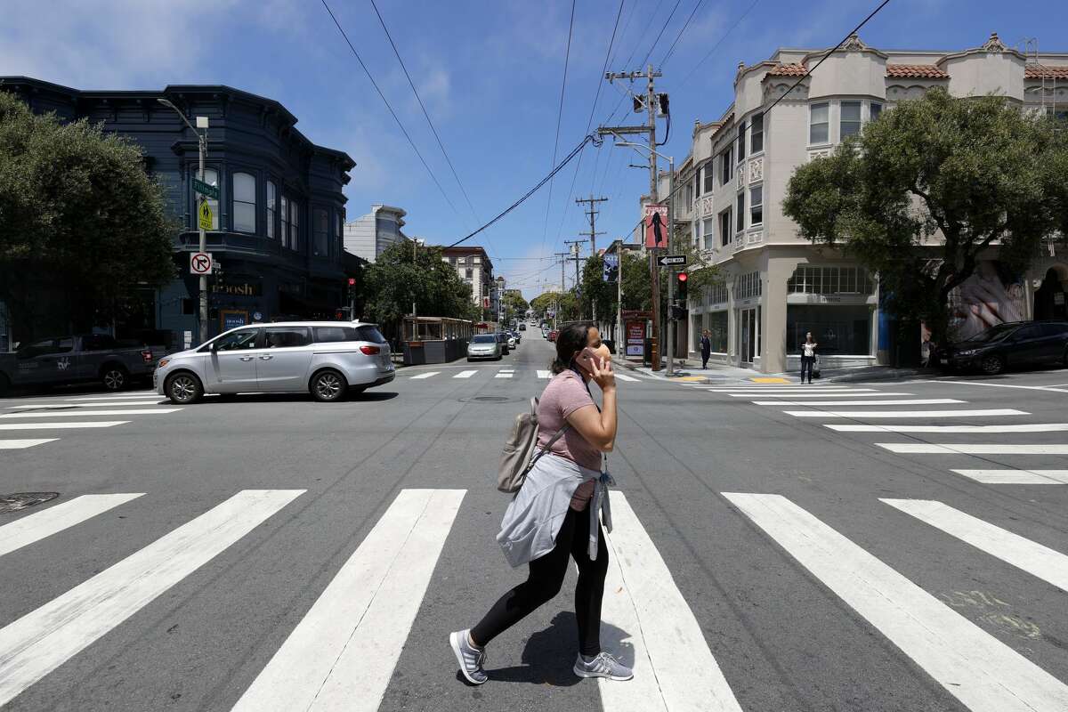 A pedestrian crosses Fillmore Street on June 14, 2021 in San Francisco, California. 