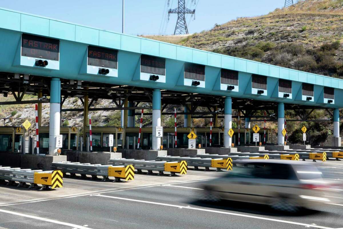 Cars travel through the Carquinez Bridge toll plaza in Vallejo in May. Tolls will rise Jan. 1 on the Carquinez Bridge and six other major Bay Area spans.