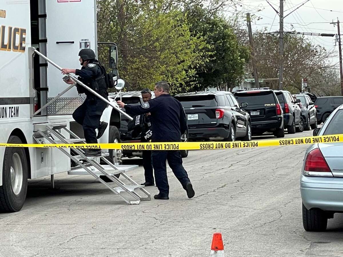 San Antonio police work to negotiate with a man who barricaded himself at a home in the 1300 block of Wheatley Avenue on Monday, Dec. 6, 2021.