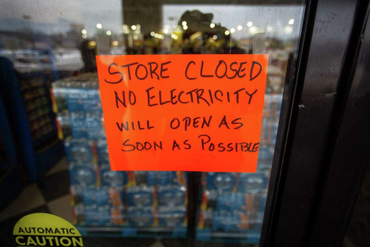 A sign states that a Fiesta Mart was closed because of a power outage in Austin, Texas on Feb. 17, 2021. Millions of Texans were without water and electric as winter storms hit the area.Texas's grid operator predicted shortfalls in power capacity in an extreme event in winter 2021-22. (Montinique Monroe/Getty Images/TNS)