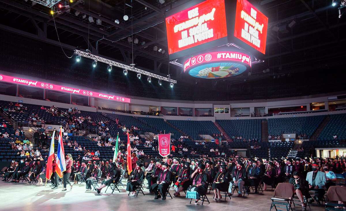 TAMIU graduates don their masks and sit socially distanced during the TAMIU Spring Commencement Ceremony, Friday, May 14, 2021, at the Sames Auto Arena.