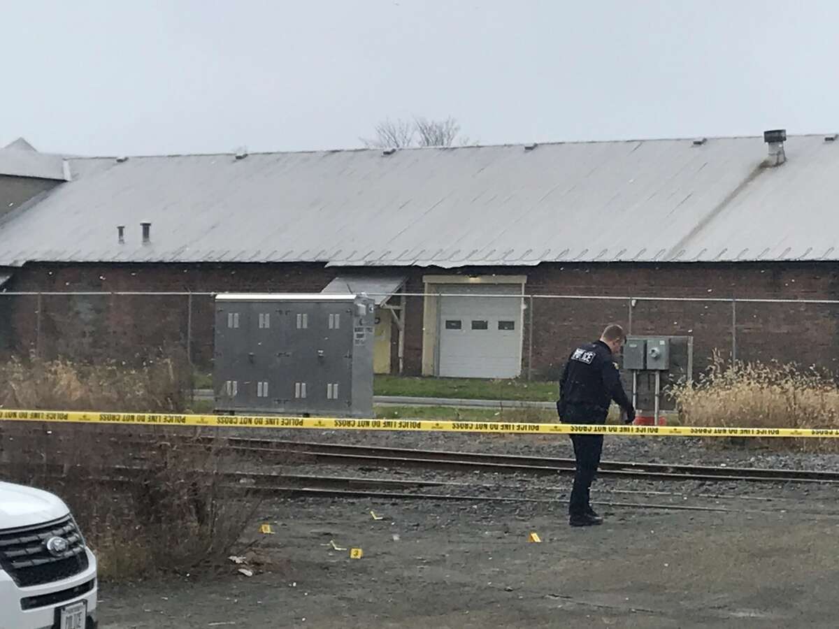 A man's body was removed from the area near train tracks along Monroe Street in Troy on Tuesday, Dec. 7, 2021. Police later described the death as an overdose.