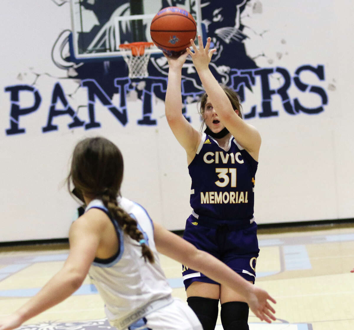 CM's Olivia Durbin (right), shown putting up a shot in a game last week at Jerseyville, scored 15 points Monday in a win at Collinsville.