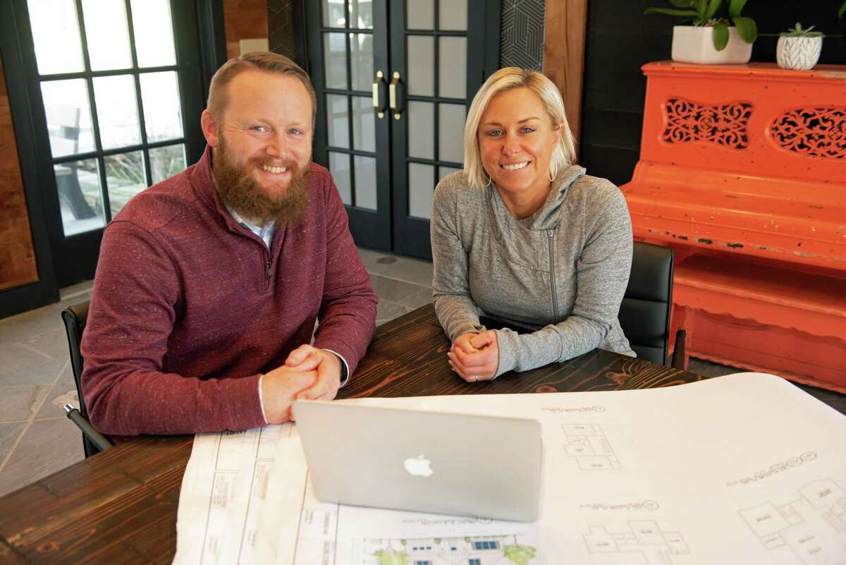 Looking over plans for the SARAH Project are Ken Alberti, SARAH Foundation executive director and Nicole White, founder of Social REdesign.