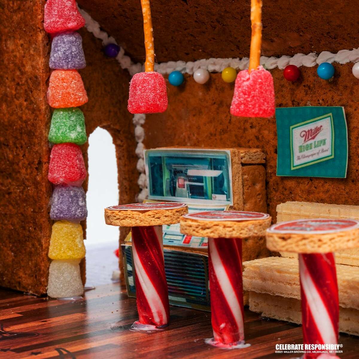 The gingerbread locale as features a number of dive bar staples like a jukebox, pool table and beer signage.