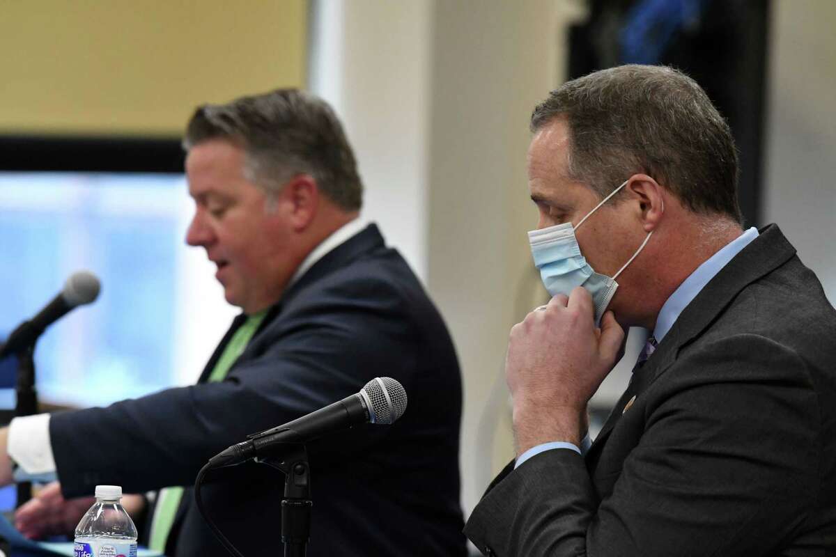 Albany County Executive Dan McCoy, left, and Schenectady County Manager Rory Fluman, right, hold a joint coronavirus news briefing to announce a county collaboration in issuing a strong indoor mask recommendation, regardless of vaccination status, on Tuesday, Dec. 7, 2021, at the county offices in Albany, N.Y.