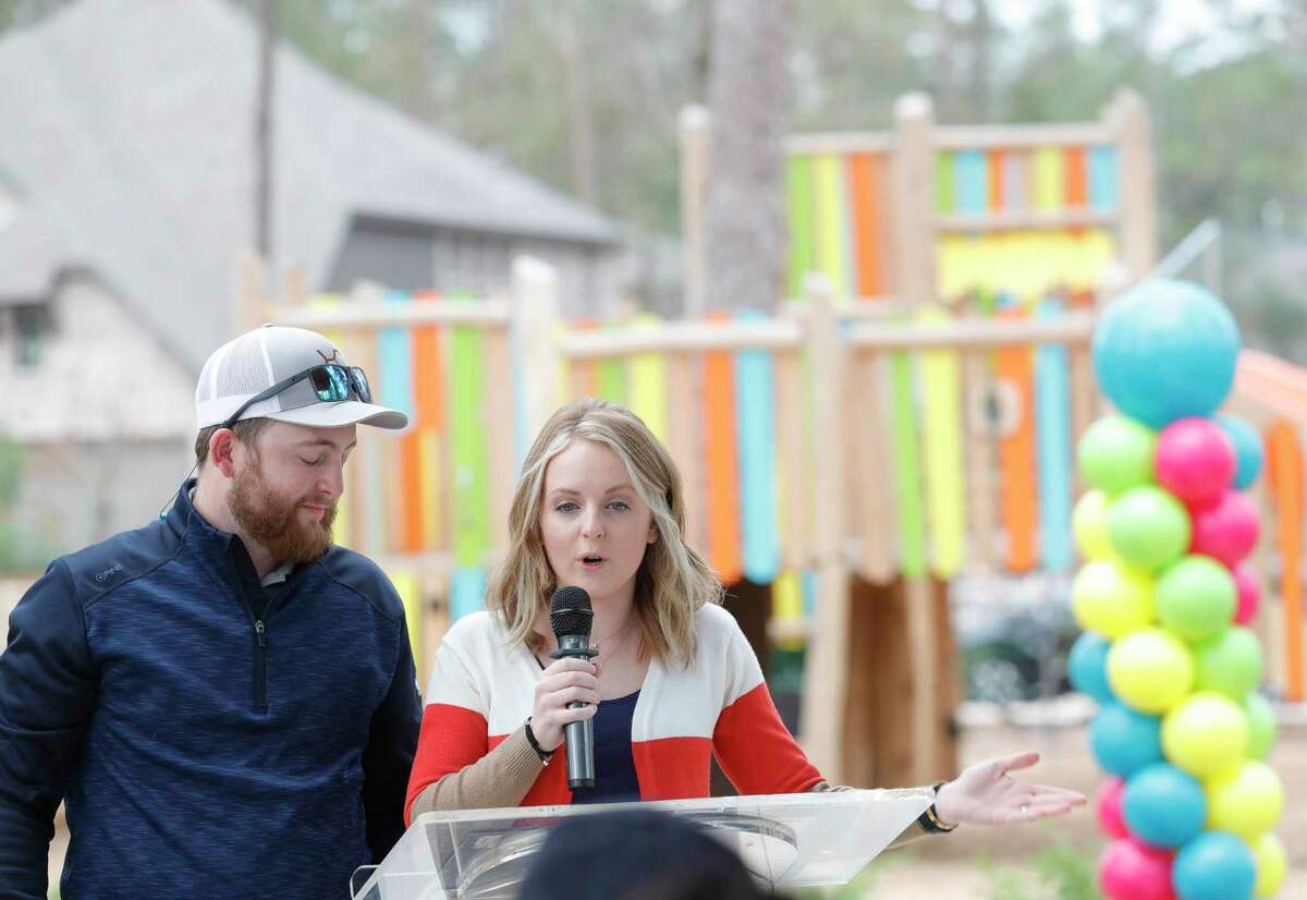Kaitlyn Waddell and Logan Peacock, children of the late Willis ISD golf coach Les Peacock, speak during a park dedication for the late Willis High School golf coach Les Peacock at The Woodlands Hills, Tuesday, Dec. 7, 2021, in Willis. Peacock’s family attended the dedication which honored the coach for his 13 years of service to the district and its students.