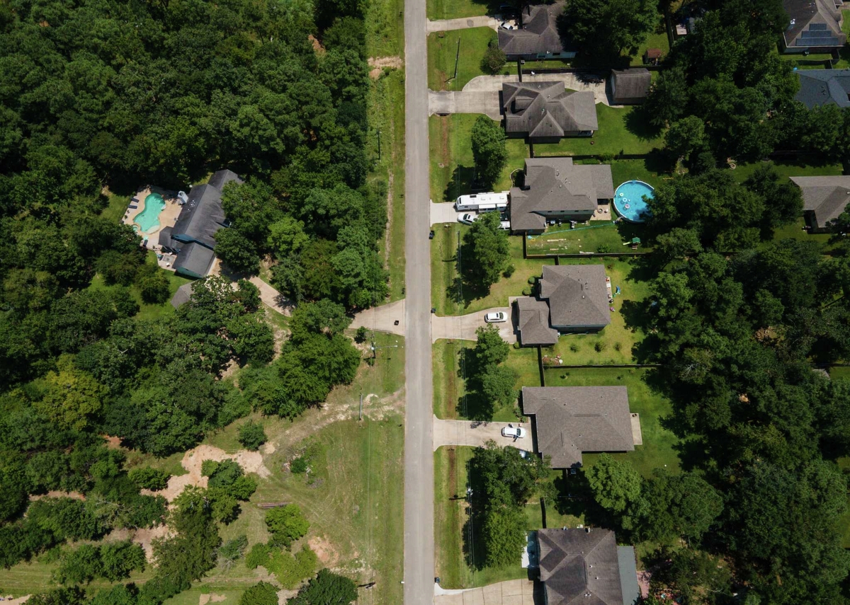 Battle Cry Ministries, a tax-exempt parsonage, shown on left, in Magnolia sits on 1.5 acres even though the law says there's a 1-acre limit. Montgomery County appraisers say the approval slipped through the cracks and plan to take action on this and three other above-one-acre parsonages in the county. Boasting five bedrooms, a pool and hot tub, this home - owned by Battle Cry Ministries - recently listed for sale at $719,000.