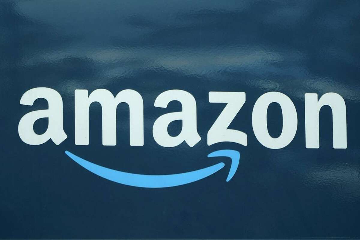 An Amazon logo appears on an Amazon delivery van in Boston on Oct. 1, 2020. 