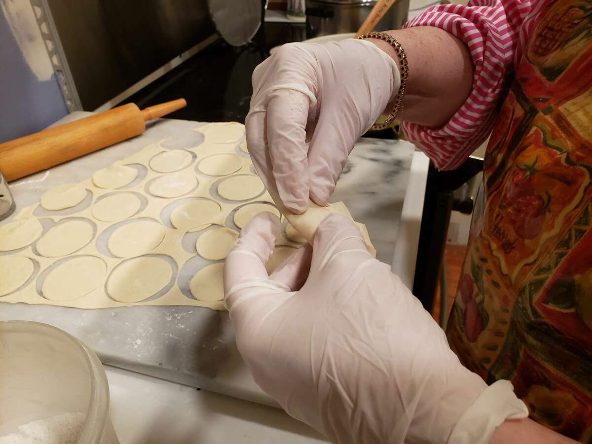 With dextrous fingers, Basia Hirsh filled and folded delicate rounds of dough into homemade Polish pierogi.