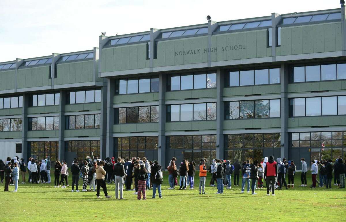 A file photo showing evacuated students at Norwalk High School on Wednesday, Dec. 1, 2021. Two schools in Norwalk, including the high school, were evacuated on Tuesday, Dec. 7 after separate fire alarms.