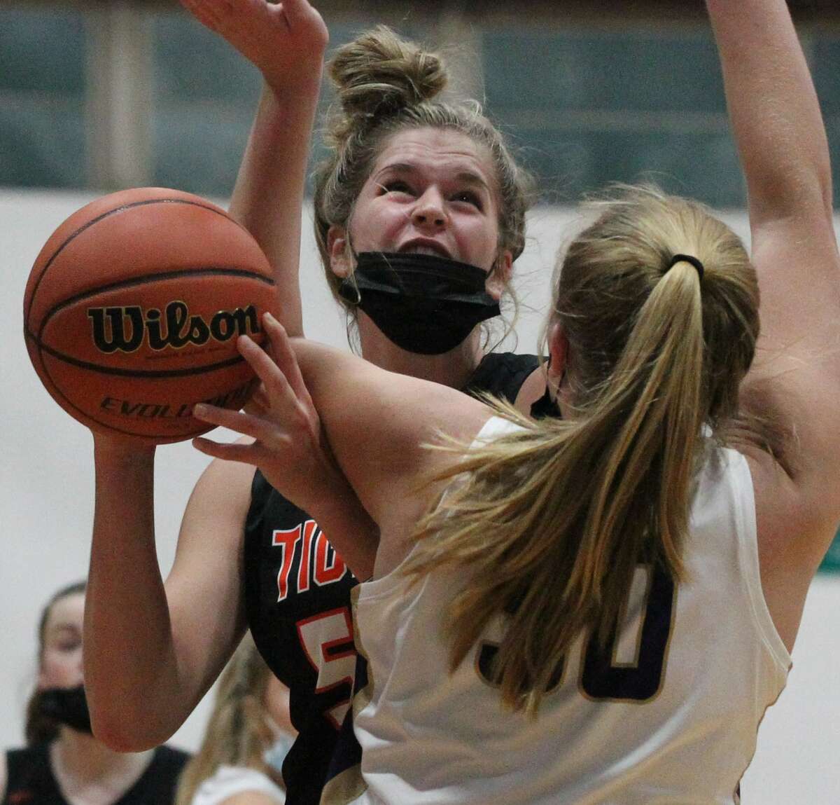 Greenfield-Northwestern's Kylie Kinser is fouled during a girls' basketball game against Routt at the Routt Dome in Jacksonville Monday night.