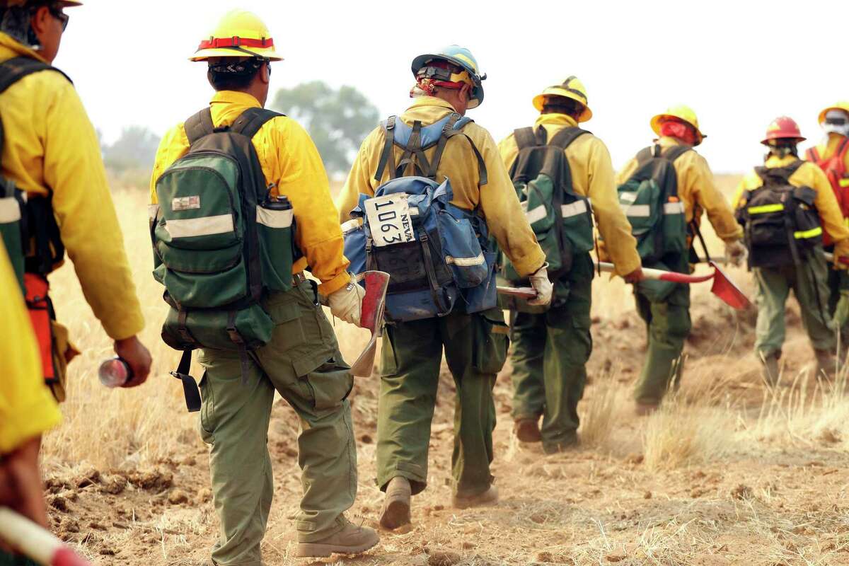 Lava River Forestry woodland firefighters work the Beckwourth Complex Fire in Lassen County, Calif. Cal Fire units have started preparations for winter after a difficult fire season, but officials are asking residents not to become complacent.