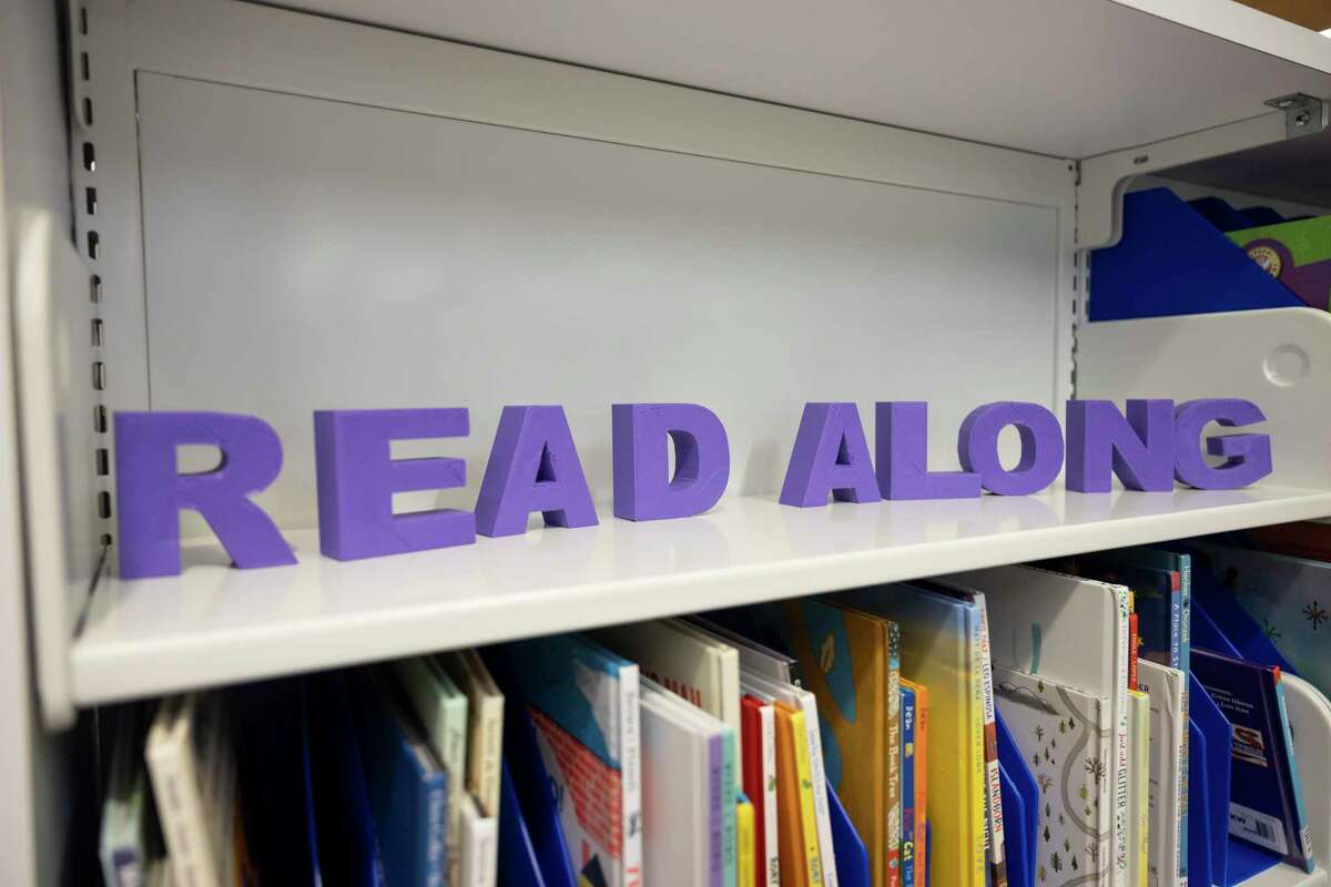 "Read Along" is set on a book shelf at the Kingwood library in Houston, Wednesday, June 9, 2021. Books in Texas school libraries are under increasing scrutiny since Gov. Greg Abbott last month called on independent school districts to rid their stacks of books containing vulgar or pornographic depictions or images.