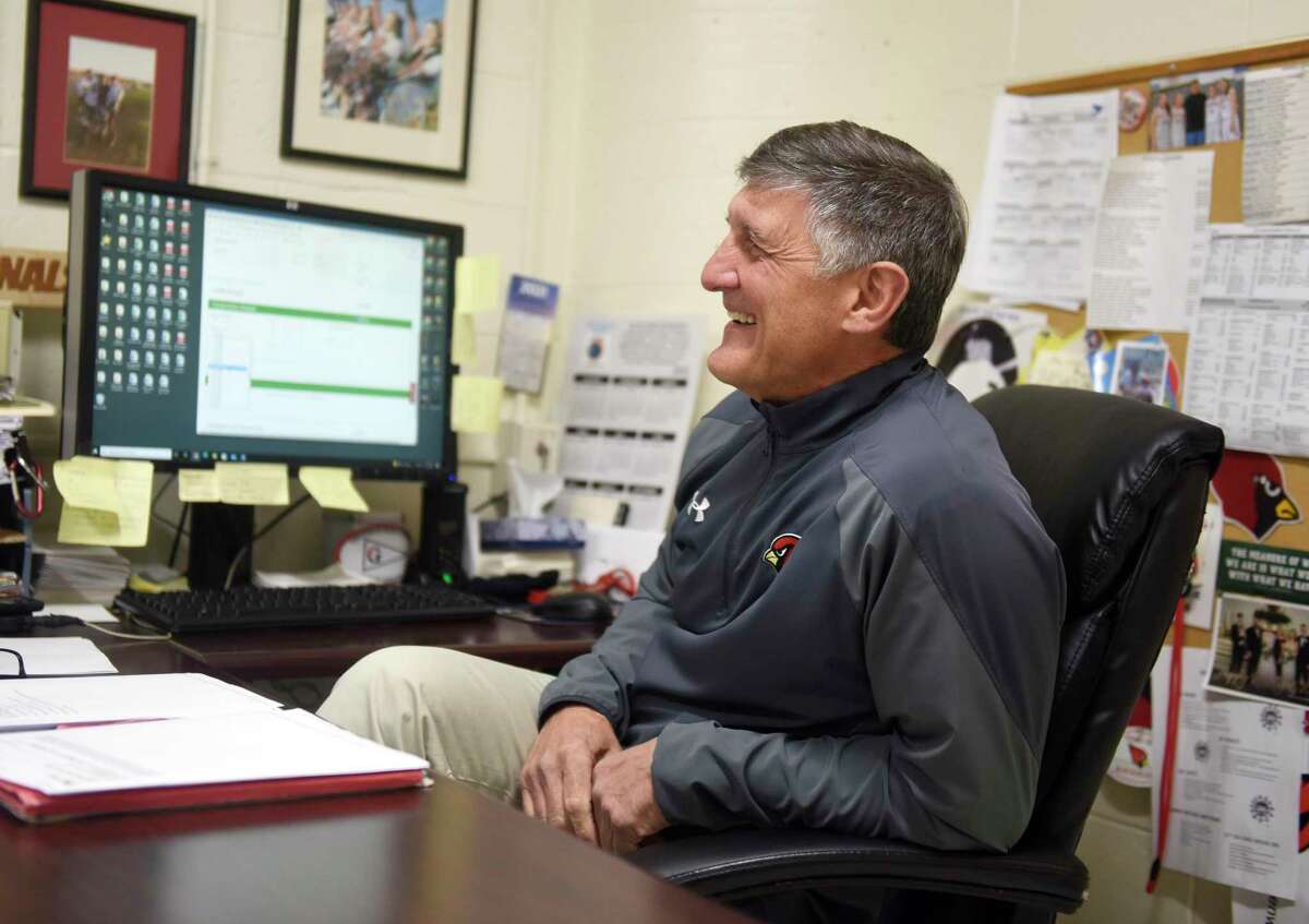 Greenwich High School Athletic Director Gus Lindine chats in his office at Greenwich High School in Greenwich, Conn. Tuesday, Dec. 7, 2021. Lindine has been the Greenwich Athletic Director since 2005 and will retire at the end of December.