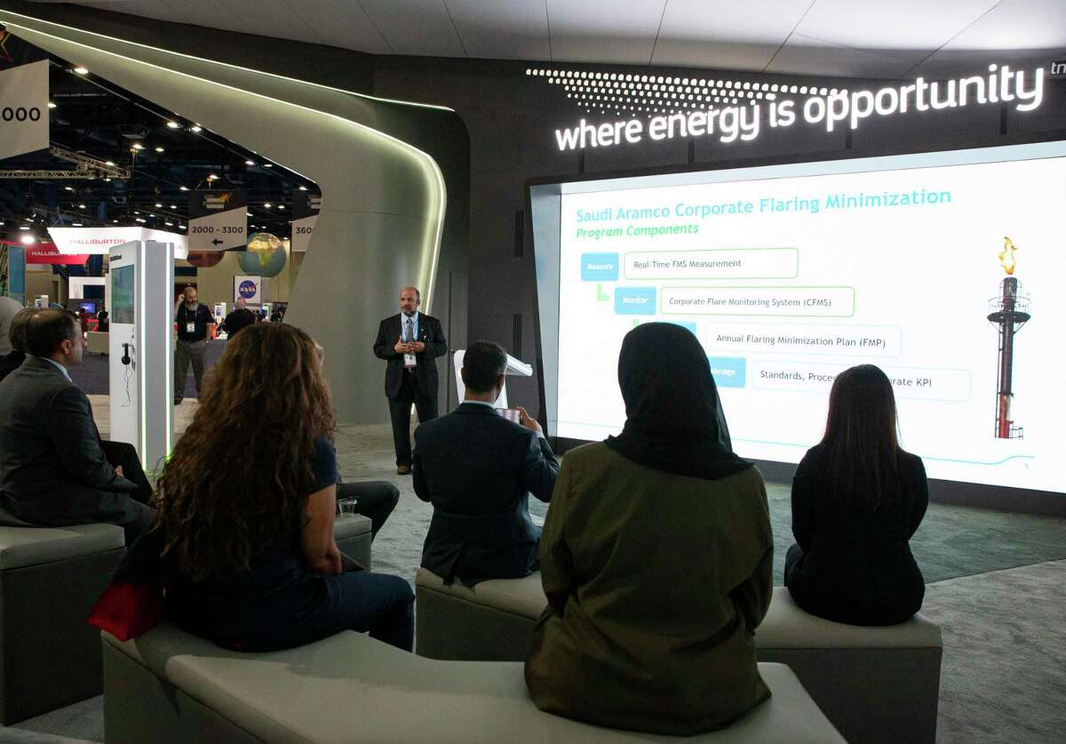 People attend a Saudi Aramco presentation on the second day of World Petroleum Congress Tuesday, Dec. 7, 2021, at George R. Brown Convention Center in Houston.