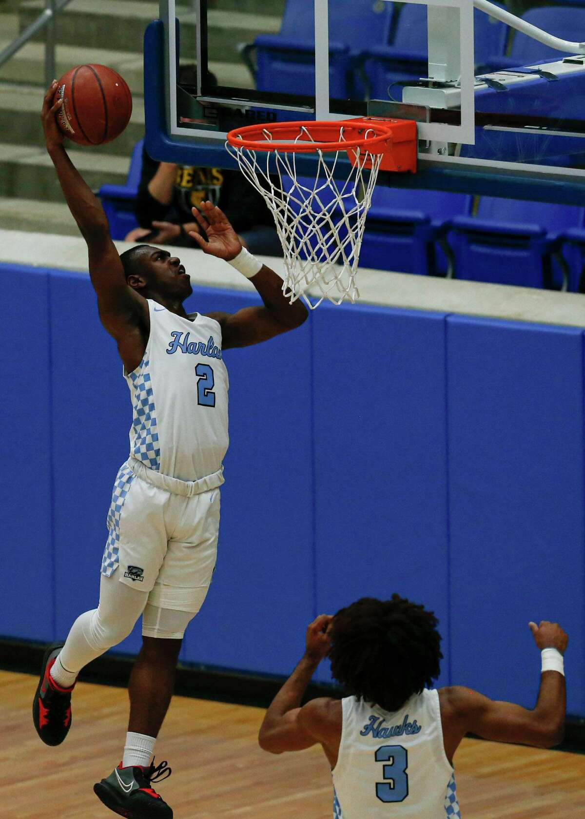 Harlan's Kalon Hargrove (2) attempts to dunk the ball during the second quarter against the Brennan Bears take on the Harlan Hawks at Northside Gym in San Antonio, Texas, Tuesday, Dec. 7, 2021. The ball bounced off the rim and the Bears won the rebound.