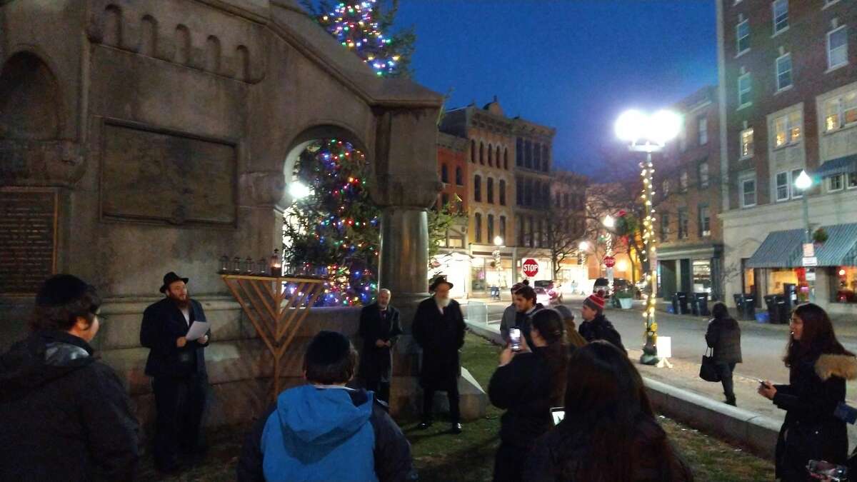 A huge menorah glows in Troy. The mayor attended the lighting of the last candle for Hanukkah 2021.