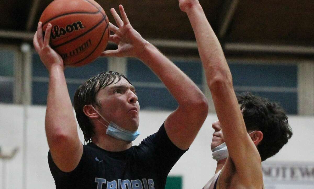 Triopia's Ryan Snow puts up a shot in a boys' basketball game against Routt at the Routt Dome in Jacksonville Tuesday night.