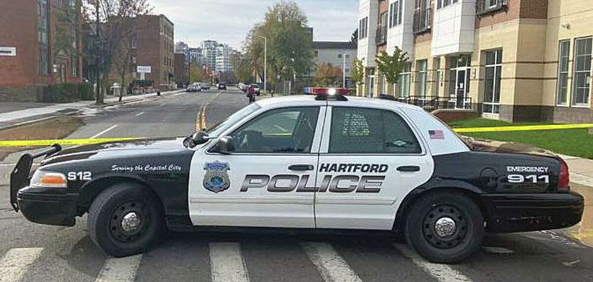 Police continue to investigate a shooting shortly before 6 p.m. Tuesday, Dec. 7, 2021, in the 100 block of Jefferson Street in Hartford, Conn.