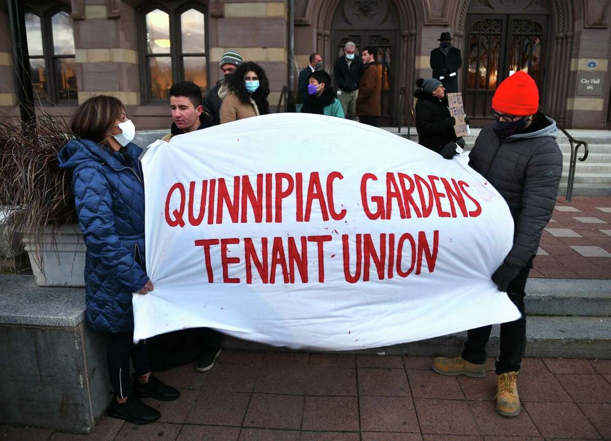 People gather in front of City Hall in New Haven for a protest of living conditions at Quinnipiac Gardens on November 29, 2021.