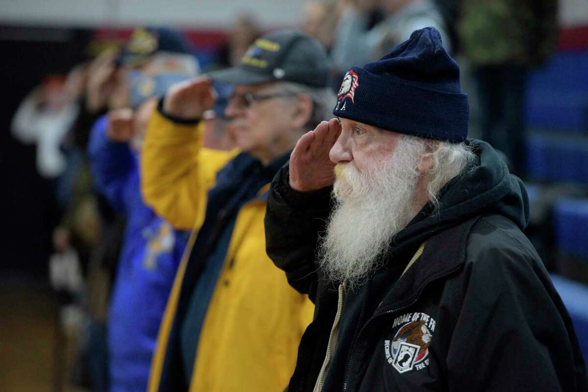 Danbury veteran Sam Barbato, U.S. Army 1969-’75, salutes during the playing of the National Anthem during the Pearl Harbor Memorial Service at the War Memorial, Danbury, Conn, Tuesday, December 7, 2021. This is the 80th Anniversary of the attack on Pearl Harbor.